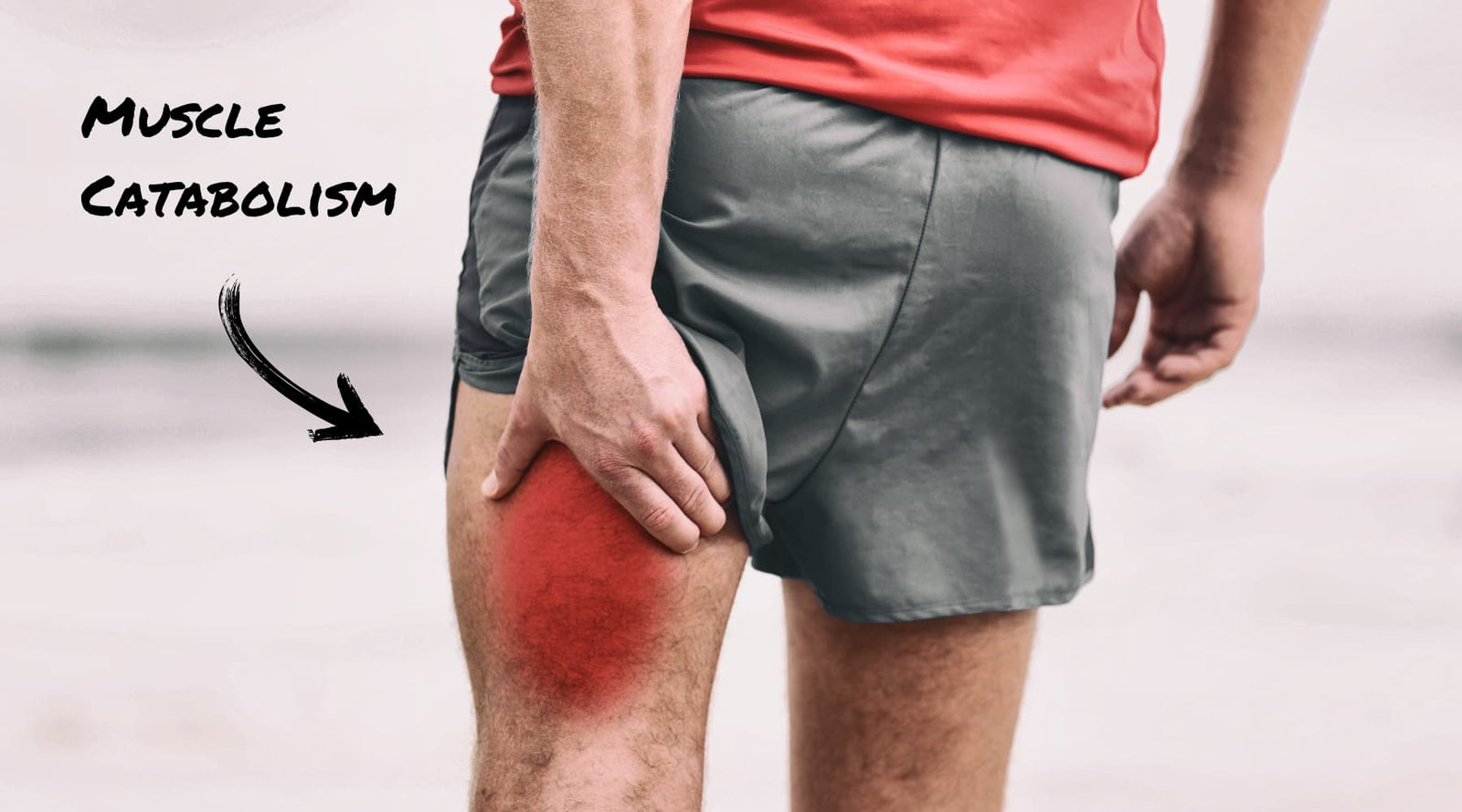Man holding his hamstring in discomfort