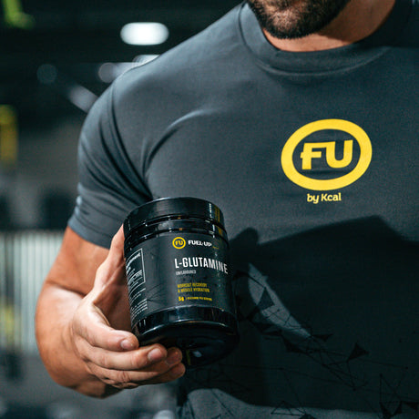 Man holding Fuel-Up L-Glutamine Supplement