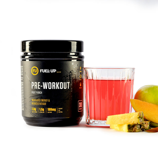 Tub of Fruit Punch Pre-Workout with a glass and mixed fruit